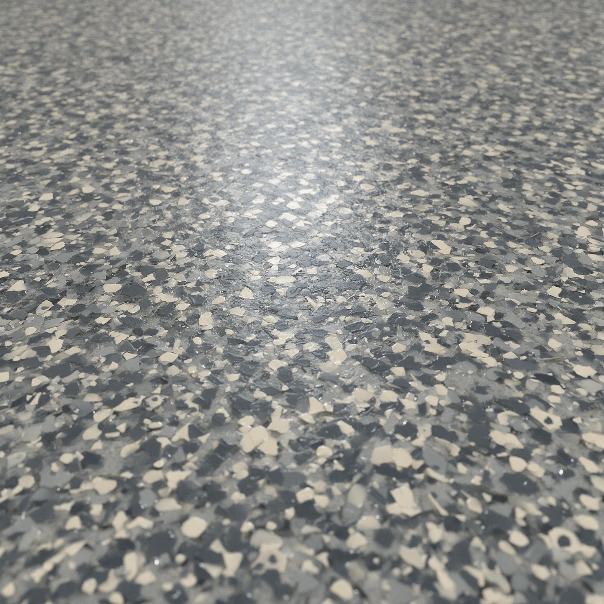 Macro view of vinyl flake epoxy with charcoal, pewter, and cream flakes in a clear topcoat.